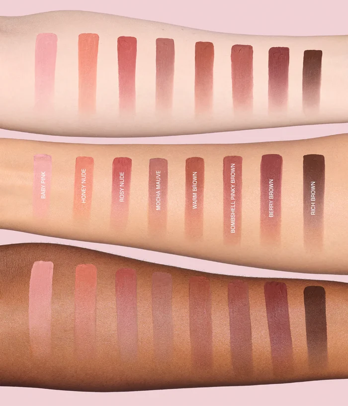 Three forearm swatches display color swatches of a makeup product in various skin tones, showing shades of pink, nude, mauve, and brown with text labels underneath.