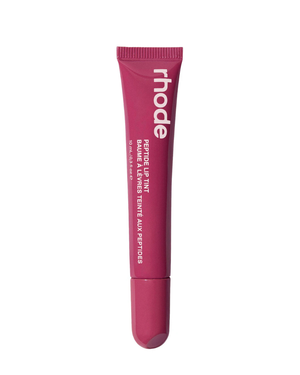 Rhode Equine Lip Tint tube in a deep magenta-pink color, featuring white text, shown on a solid white background.