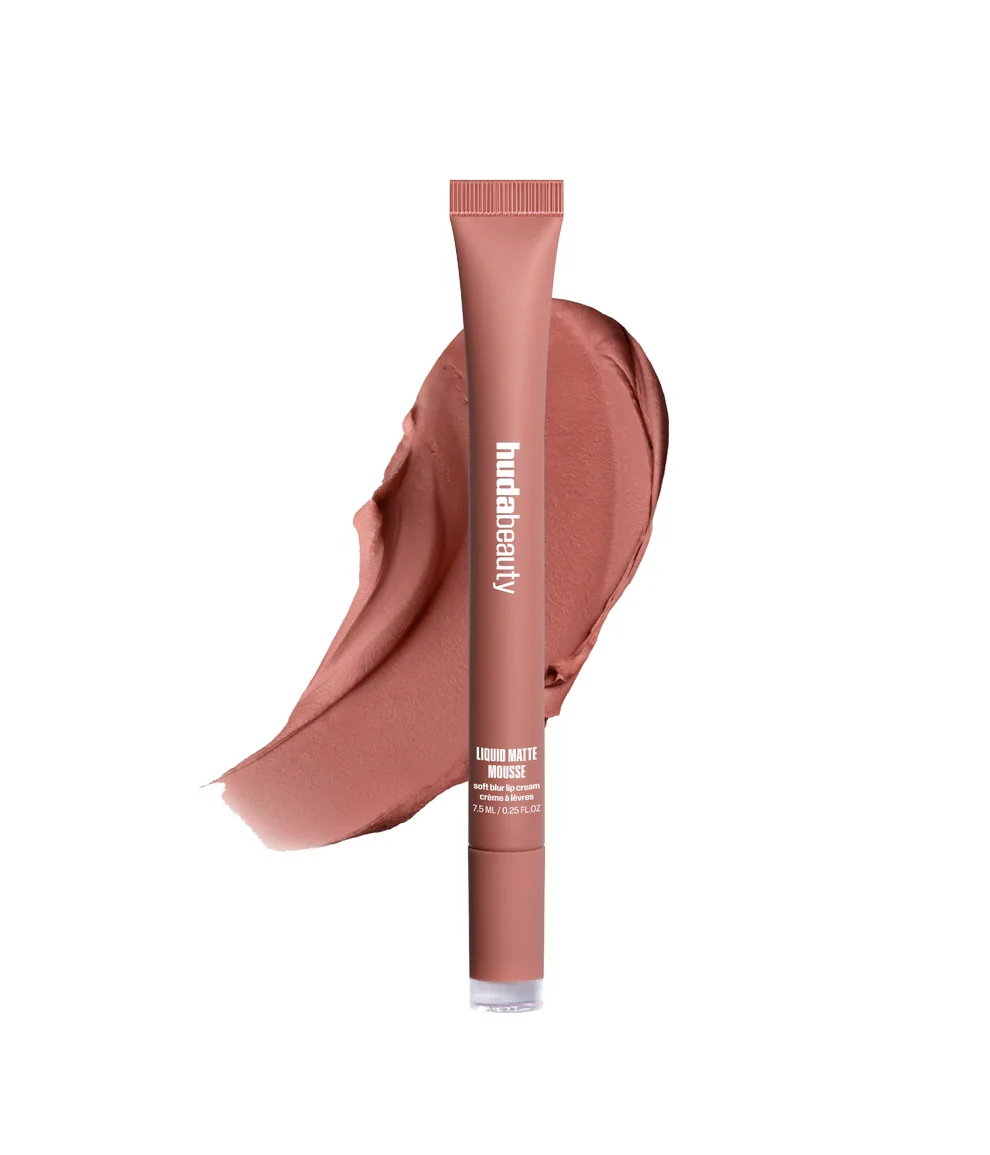 Lipstick tube with a swatch of pink lipstick on a white background