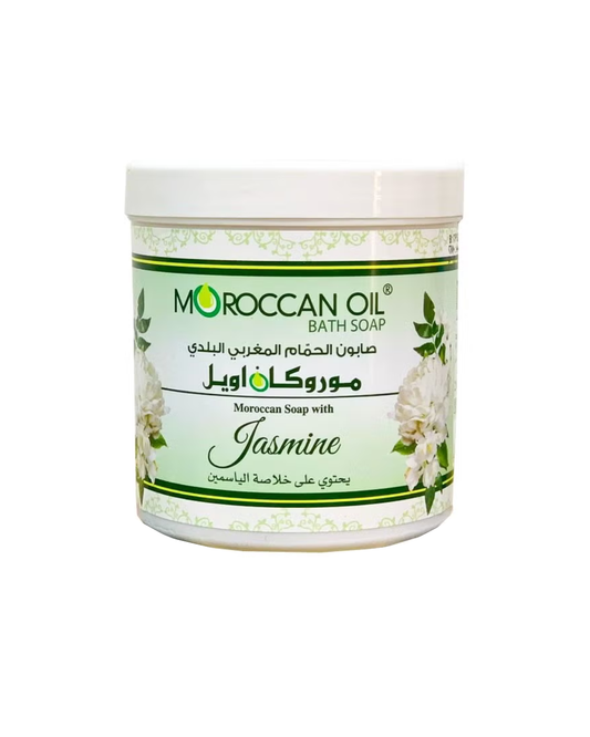 A white plastic jar of Moroccan Oil Bath Soap with Jasmine scent, featuring a white and green label with floral illustrations.