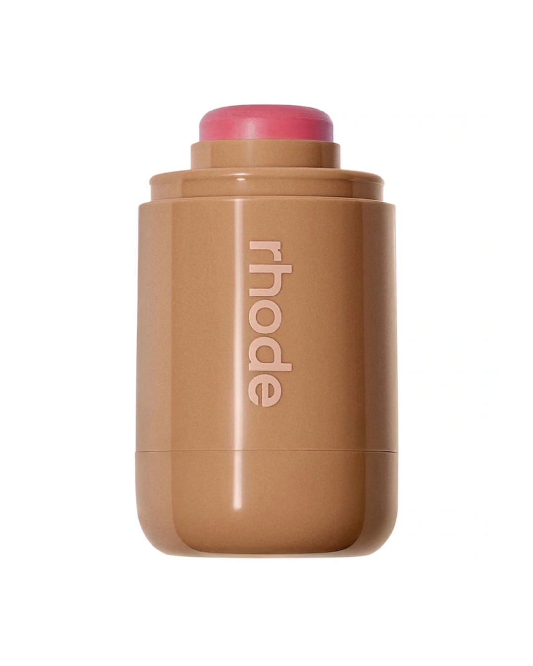 A Rhode makeup stick in a pink shade  shown on a solid white background.