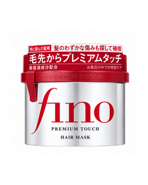 A white plastic jar of fino Premium Touch Hair Mask with a red lid and red branding, shown on a plain white background.
