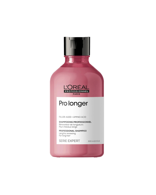 A 300 ml bottle of L'Oréal Professionnel Paris Pro longer shampoo in a translucent pink bottle with a black cap and white label, set against a plain white background.