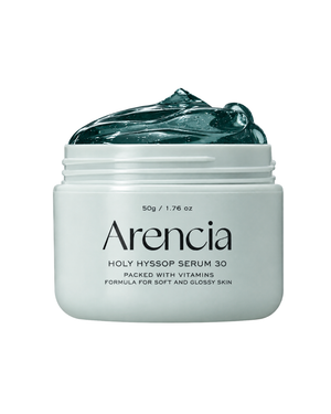 A white jar of Arencia Holy Hyssop Serum 30 with a dark green gel product visible at the top, set against a plain white background.