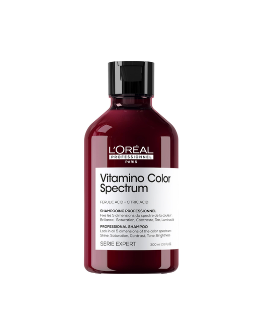 A bottle of L'Oréal Professionnel Paris Vitamino Color Spectrum Professional Shampoo, featuring a translucent deep burgundy bottle and a black cap, set against a plain white background.